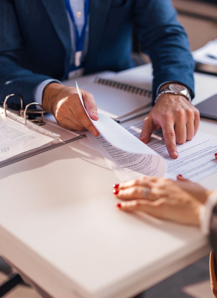 Two people reviewing a financial plan together at a table
